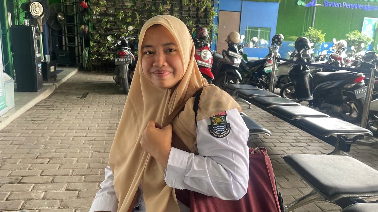 Yuliana, (38) warga Pondok Aren, Pegawai Dinas Tenaga Kerja telah merasakan manfaat dari Program JKN sekama 12 tahun. (ist).